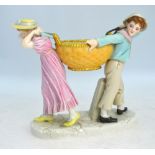 A Victorian Royal Worcester porcelain group of two children carrying a blush ground basket,
