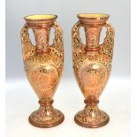 A pair of Hispano-Moresque vases, each on conical,