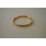 A 22ct yellow gold court style wedding band,