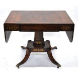 A Regency brass inlaid rosewood sofa table,
