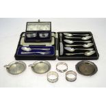 A cased set of six silver grapefruit spoons, the matching knife with loaded silver handle,