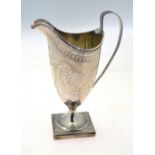 Peter & Ann Bateman - a George III silver cream jug with reeded rim and handle and engraved