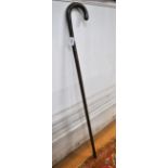 An unusual rattan-pole self-defence walking stick concealing a weighted cosh on spring, c.