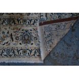 A large Persian Nain carpet, the flowering vine design on traditional off white/camel ground,
