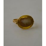 A Roman shell cameo ring featuring a bull in yellow gold setting Condition Report No