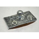 An Edwardian silver rocker-blotter, embossed with Art Nouveau floral decoration,