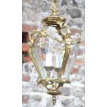 An Art Nouveau style brass hall lantern with curved glass panels 45 cm high approx