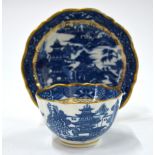 A Caughley Willow Pattern teabowl and saucer; each one highlighted with gilt rims,