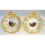 A pair of Flight, Barr and Barr dishes; each one decorated with gilt rims and a central,