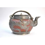 A white metal mounted Yixing teapot with looped handle,