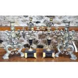 A pair of gilt metal five candle mantle sticks raised on marble and slate bases on cast feet to/w a