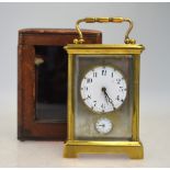 A French brass carriage clock with alarm and luminous beads to dial, 11.