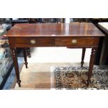 A late Victorian mahogany two drawer side table, raised on turned,