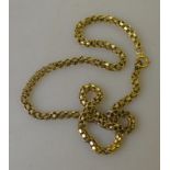 A yellow metal necklace chain,