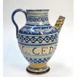 An Italian Majolica wet-drug jar with loop handle and cylindrical spout;