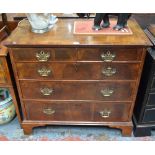 An 18th featherbanded mahogany chest of two short over three long graduated drawers,