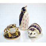 Three Royal Crown Derby animals, comprising: a hedgehog, 11 cm long; an Emperor Penguin,