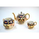 A Davenport Imari decorated tea service, comprising: a teapot,