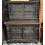 An 18th century and later heavily carved oak cabinet,