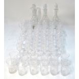 A Stuarts Crystal suite of drinking glasses including two decanters and a claret jug,