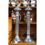 A pair of large electroplated reeded-column table lamps,