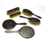 Two pairs of silver tortoiseshell and pique-work hairbrushes with hand-mirror, Birmingham 1926/27,