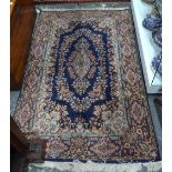 A Persian Kirman rug, blue ground,