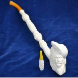 A modern Turkish Meerschaum large pipe, the bowl carved with a Sultan's head,
