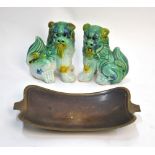 A pair of mottled glazed Buddhistic Lions, 9 cm high; together with a metal tray,