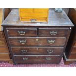 A 17th century joined oak chest of two short over three long graduated drawers raised on stile feet,