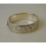 A half-engraved hollow silver hinged bangle Condition Report Bruised