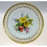 A Meissen cabinet plate with reticulated rim, painted with spring flowers and blossom,
