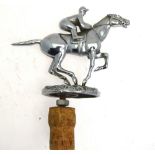 A chromium plated racehorse and jockey car mascot,