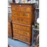 A small 19th century featherbanded walnut chest on chest,