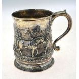 An 18th century silver mug with scroll handle,
