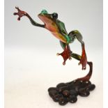 Tim Cotterill (b 1950) 'Frogman', a lacquered bronze leaping frog on pebble base,