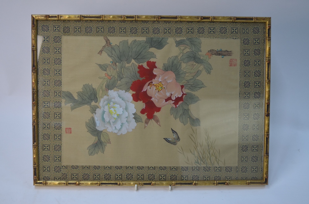 A Chinese picture on textile of a butterfly beside flowers, framed and glazed,