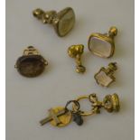 A collection of five gold and gilt metal seals, crested and engraved,