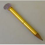 An antique bloomed gold bridge pencil having a carved amethyst rabbit head terminal with diamond