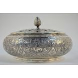 A Persian white metal pot pourri bowl with pierced domed cover and knop finial,
