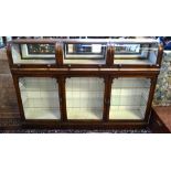 An antique glazed mahogany retailers/collectors display cabinet,