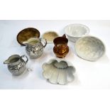 Five ceramic jelly moulds including a Shelley example and three English lustre jugs (8)