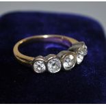A five stone old cut diamond ring in white metal collet setting, approx 0.