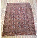 An antique Turkoman rug, the three row gul design on mid-red ground, 1.65 x 1.