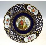 A Meissen blue ground cabinet plate with reticulated rim,