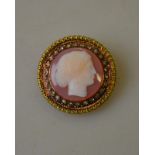 An early Victorian sardonyx cameo of female with rose diamond surround set in three-coloured gold