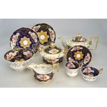 A Ridgway part tea service circa 1825, gilded mazarine blue ground painted with floral reserves,