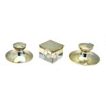 Two weighted silver capstan inkwells,