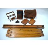 A mahogany quarter-plate camera with plate-holders and two tripods,