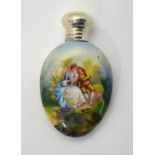 An Edwardian oval small scent flask, decorated with a courting couple, with silver screw bun cover,